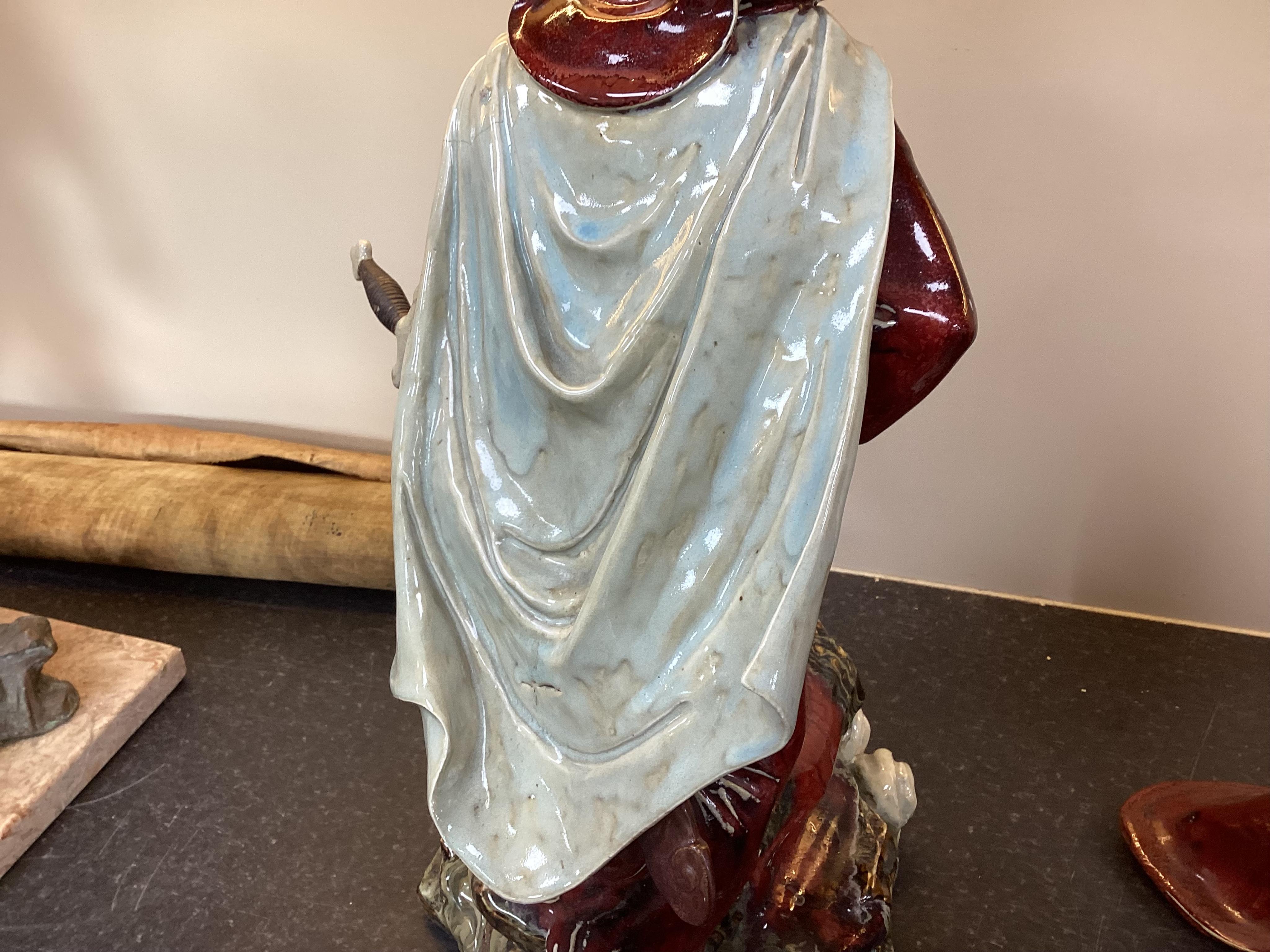 A large Chinese Shiwan stoneware figure of a warrior, 20th century